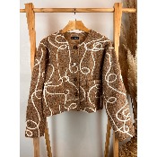 Veste courte duveteuse motifs boucles